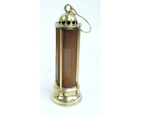 A Stephenson miner's safety lamp made by I Mills, Newcastle-upon-Tyne, complete with inner glass, circa 1850, height 25.5cm. 