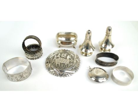 A small group of variously hallmarked silver items comprising a salt and pepper, Henry Williamson Ltd, Birmingham 1924, an ov