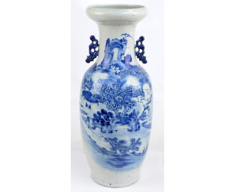 A large 19th century Chinese baluster vase with raised rim painted in underglaze blue with architectural landscape, with twin