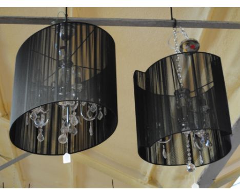Two contemporary light fittings, one with three scrolling branches with glass drops, the second with five scrolling branches 