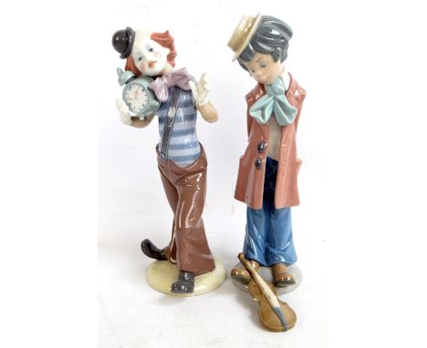 Two Lladro figures of clowns, one holding an alarm clock, height 32cm (one af).   CONDITION REPORT:  The figure with hands be