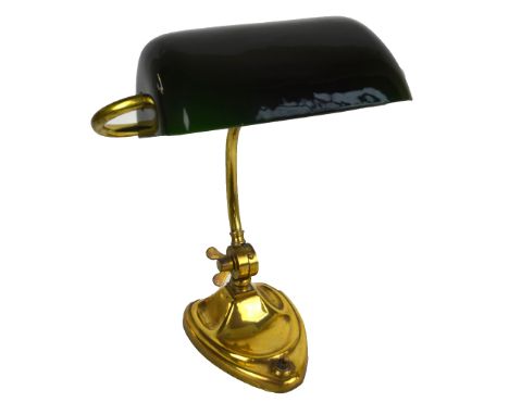 A circa 1900 brass student's lamp, the green and white opaque glass swivel shade above tubular frame and heart shaped loaded 