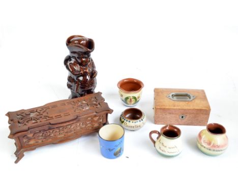 A 19th century treacle glazed snuff taking Toby jug, five pieces of Motto Ware, a jewellery box and a fretwork decorated lidd