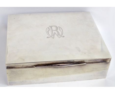 HERMANN BEHRND; an early 20th century German silver cigar box of plain rectangular form initialled RW to the hinged lid enclo