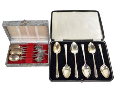 A cased set of six Elizabeth II hallmarked silver grapefruit spoons, Sheffield 1964 and a cased set of six Dutch silver comme