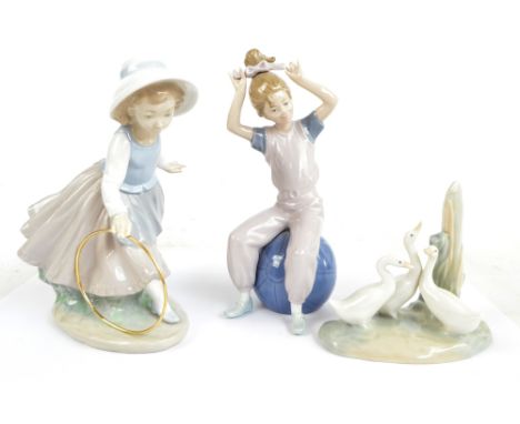 Three Nao figures; a girl playing with hoop, a girl seated on ball and three geese (af) (3).   CONDITION REPORT:  One of the 