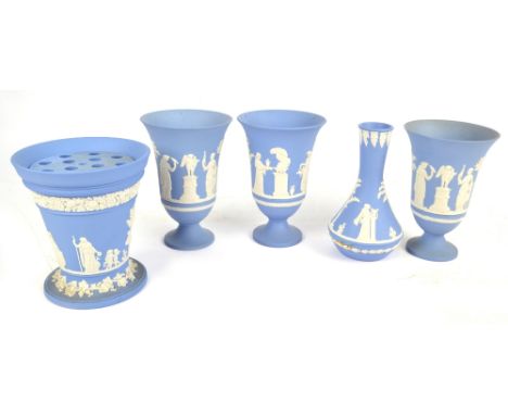 WEDGWOOD; a set of three light blue jasperware bell shaped footed vases decorated with classical figures, height 18.5cm, a si