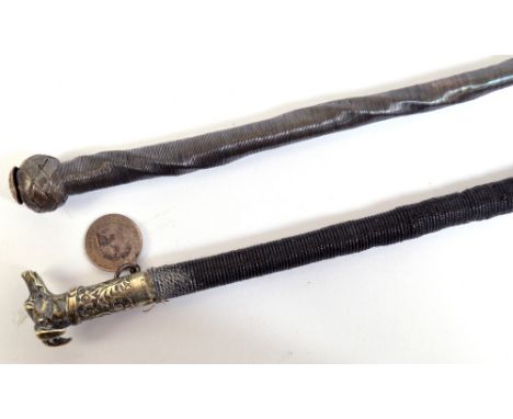 A good and unusual lady's carriage whip, with white metal dog's head finial, inscribed 'Ashford Maker' with foliate scroll de