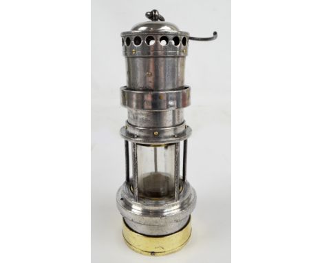 An early 20th century unnamed nickel and brass miner's safety lamp, height 25.5cm.   CONDITION REPORT:  The postage cost to t