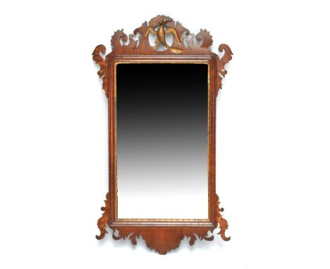 A late 19th century Chippendale style fret carved wall mirror.