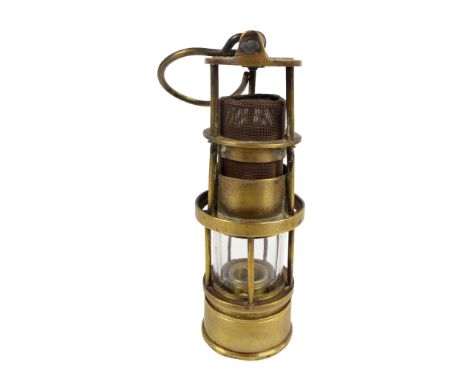 A Johnson Clapham & Morris of Manchester 'Deflector' Howard's Patent miner's safety lamp, height 20cm.