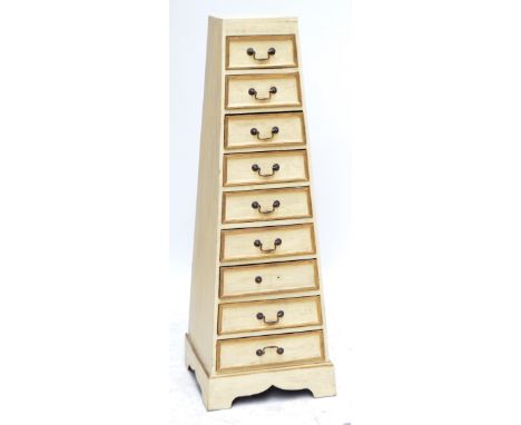 A reproduction painted pyramid shaped chest of nine short drawers raised on bracket feet, height 145cm.