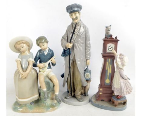 A Lladro figure of a man holding a large bunch of keys and lamp, a Lladro figure of a young boy and girl and a Lladro figure 