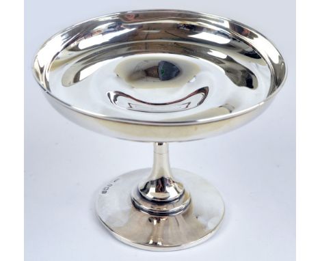 An Edward VII hallmarked silver circular bonbon dish of plain form raised on waisted stem above stepped circular base, maker'