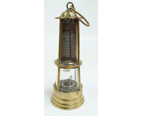 A 19th century miner's safety lamp, unnamed, stamped '1817', height 24cm.   CONDITION REPORT:  Appears to be in reasonable co