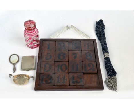 A small group of collectors' items to include a clear and cranberry tinted glass scent bottle, a silver salt modelled as a st
