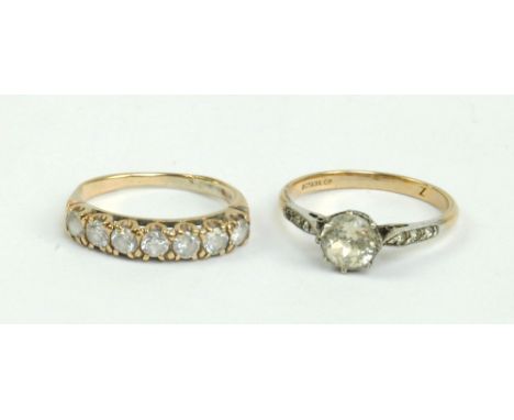 A 9ct yellow gold and silver costume ring set with oval cut cubic zirconia, size N, and a further yellow metal example, size 