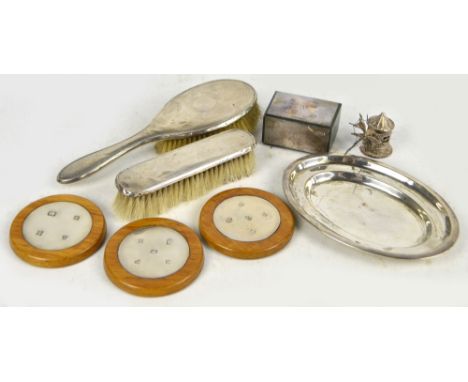 A small collection of silver items including three wooden coasters with inset Queen Elizabeth silver discs with prominent hal