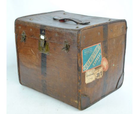 A vintage canvas trunk with leather handle and brass lock and clasps, width 46cm.