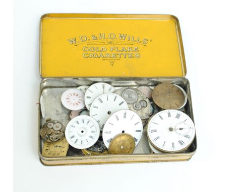 A group of pocket and wristwatch enamel dials, some with movements.