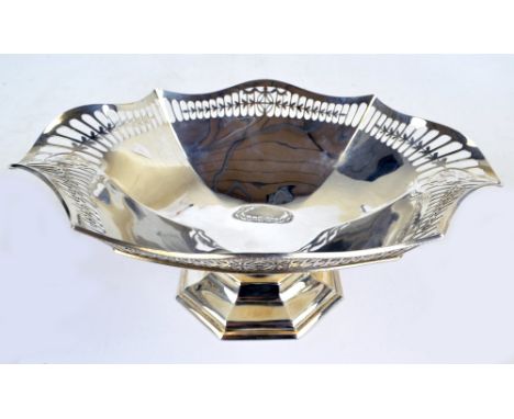 ROBERTS & BELK; a George V hallmarked silver shaped oval faceted bowl with husk pierced rim, raised on waisted stem above oct