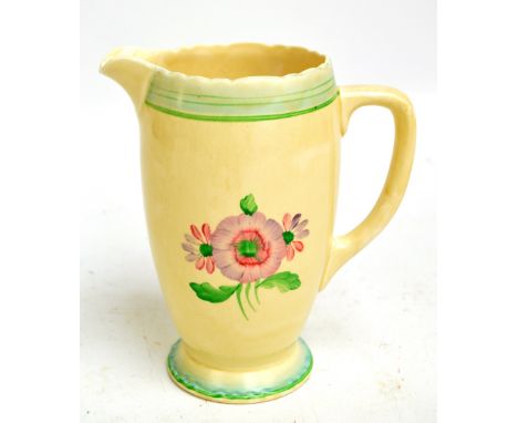 CLARICE CLIFF; a water jug of rounded ovoid form decorated with green concentric bands to crimped rim and base and central fl