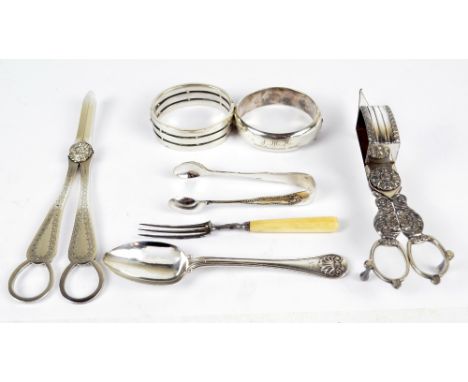 A pair of electroplated grape scissors, snuffers and sugar tongs, also a silver spoon, a snap bangle, etc (7).