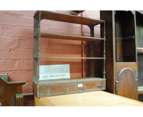 A mahogany shelf unit.