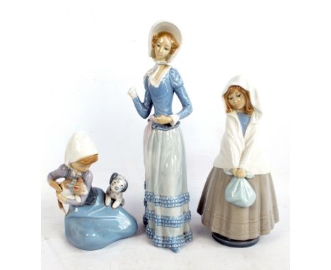 A Lladro figure of a young girl holding a kitten away from a puppy, a further Lladro figure of a young woman (af) and a Nao f