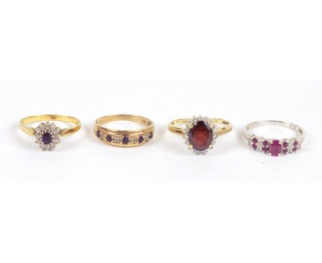 An 18ct yellow gold ruby and white sapphire cluster ring, size R, two further 9ct gold dress examples and a 9ct white gold ru