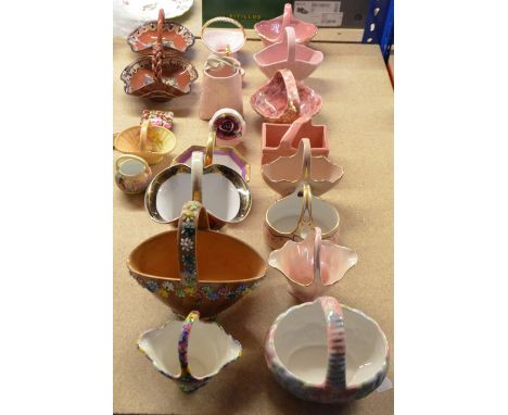 A collection of 20th century ceramic baskets, including a Royal Worcester blush ivory and floral decorated example with puce 