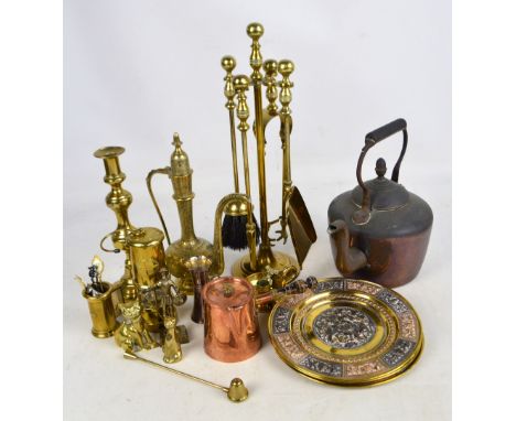 A collection brass ware including a four piece companion set, Eastern lidded jug, Indian plaques, measures, ornaments, miner'