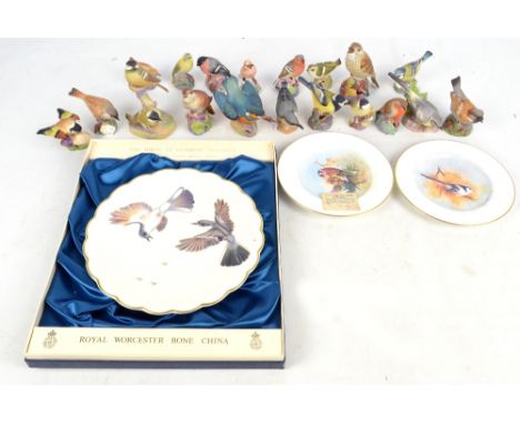 A collection of Royal Worcester birds to include 'Kingfisher', 'Gold Crest', 'Blue Tit', and 'Thrush', also a pair of hand pa