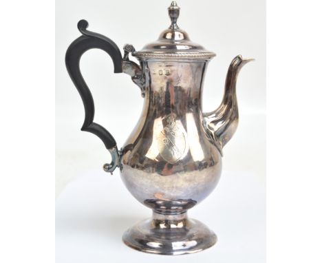 JOHN KING (probably); a George III hallmarked silver baluster coffee pot of small proportions with stepped hinged lid and ebo