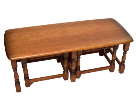 An Ercol nest of three occasional tables.