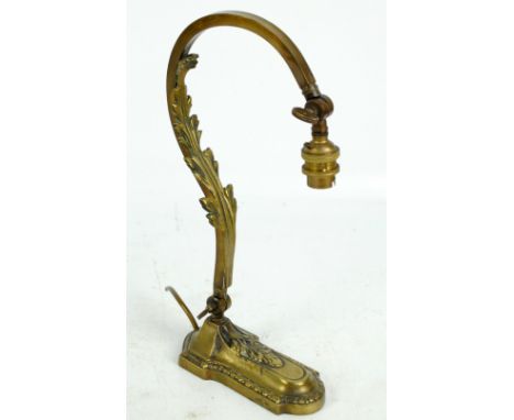 A circa 1900 brass adjustable lamp, with square sectioned foliate decorated scrolling branch, wing nut attachment with monogr