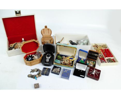 A quantity of costume jewellery including necklaces, brooches, earrings, rings, etc, including a charm bangle and a charm bra