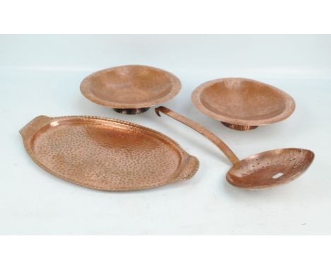 Four copper items comprising twin handled oval serving tray, two bowls and a sifting ladle (4).