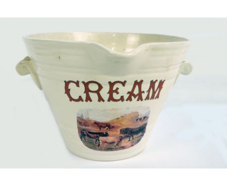 A circa 1900 English white glazed cream pail with moulded handles and lip and with transferred vignette depicting a landscape