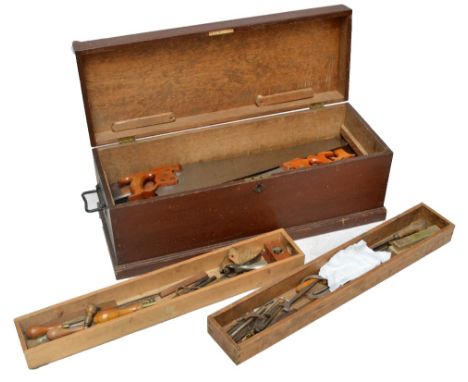 An early 20th century tool chest containing a quantity of vintage tools.