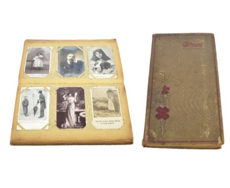 An early 20th century post card album including topographical views, some portrait real photograph cards, local views, etc.