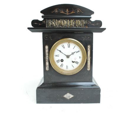 A 19th century French black slate and marble detailed mantel clock with domed pediment set with cast brass mythological figur