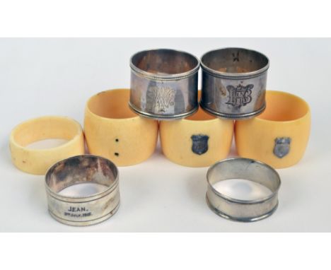 MALE & JONES; a pair of Edward VII hallmarked silver bead decorated napkin rings, Chester 1909, two further examples, also a 