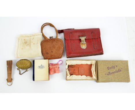 An interesting collection of French fashion doll accessories, including an Art Nouveau decorated pressed leather handbag, a s
