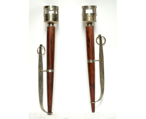 A large pair of metal and wooden wall lights, with bracket supports, tapering turned wooden stems and large pierced upper sec