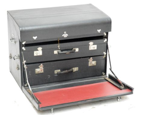 A circular 1940s Brexton of Birmingham motoring trunk, with fall-front enclosing three suitcases, 76.5 x 44 x 56cm.   CONDITI