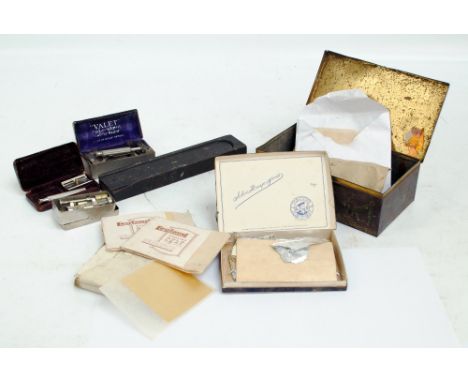 A small quantity of collectors' items comprising a quantity of gold and silver leaf contained in a vintage tin, two boxed raz