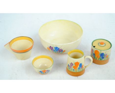 CLARICE CLIFF; three 'Crocus' Bizarre pieces comprising a cream jug, height 8.5cm, honey pot, height 7.5cm, tea bowl, diamete