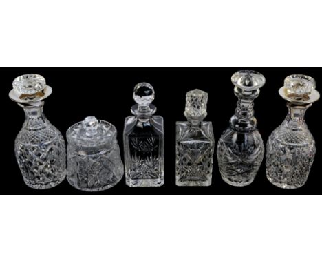 HENRY PERKINS & SONS; a pair of George V hallmarked silver collared clear cut glass bottle decanters with flared rims, London