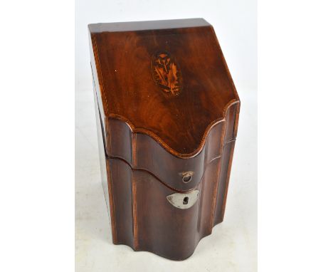 A Georgian mahogany and inlaid serpentine fronted knife box decorated with floral motif to the hinged lid enclosing a fitted 
